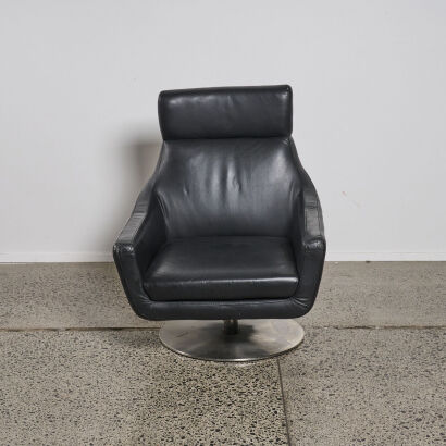 A Minimal Black Swivel Chair with Metal Base