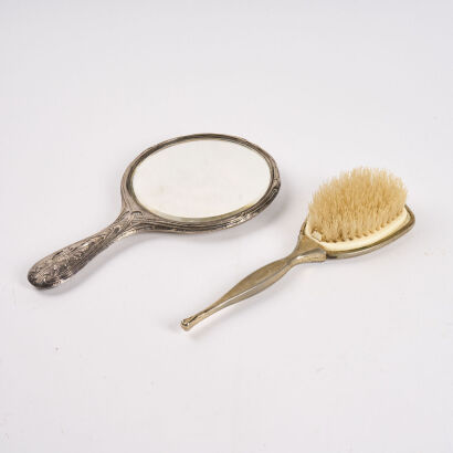 A Vintage Mirror And Hairbrush