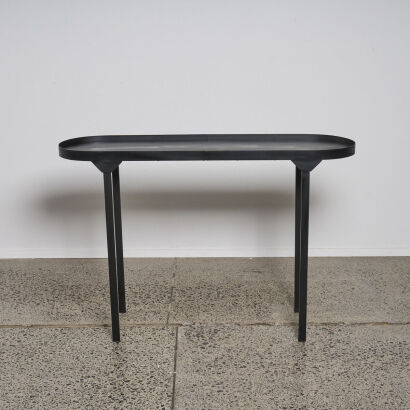 A Contemporary Oval Black Metal Console Table