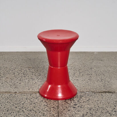 A Red Plastic Caroma Stool