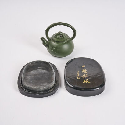 A Chinese Ink Stone And Teapots