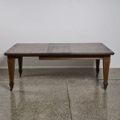 A Regency Extendable Dining Table With Inlay Legs