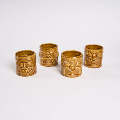 A Set Of Four Tiki Mugs