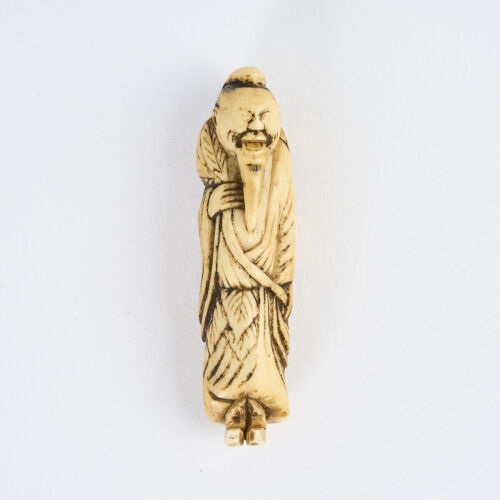 An 18th Century Stag Antler Standing Sennin Figure Netsuke