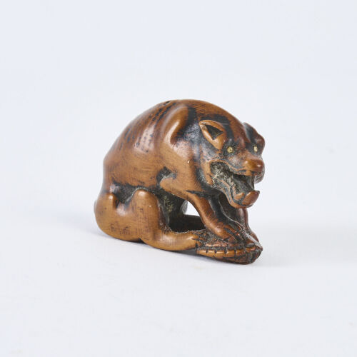 An 18th Century Edo Period Carved Wooden Netsuke Of A Woolf By Tomotada