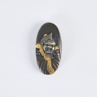 An Edo Period Ichinomiya School Jewel Kashira Of A Robed Man, 18th Century