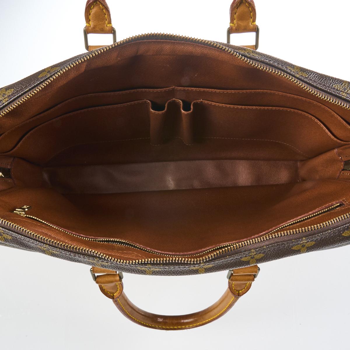 Sold at Auction: Louis Vuitton - a vintage Monogram zipped travel