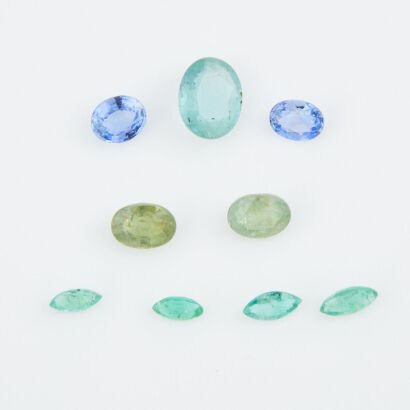 A collection of Loose Gemstones, 4 Marquise Emeralds, 2 Demantoid Garnets, 2 Sapphires and 1 Oval Emerald.