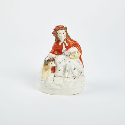 A Ceramic Girl Holding a Basket with Dog