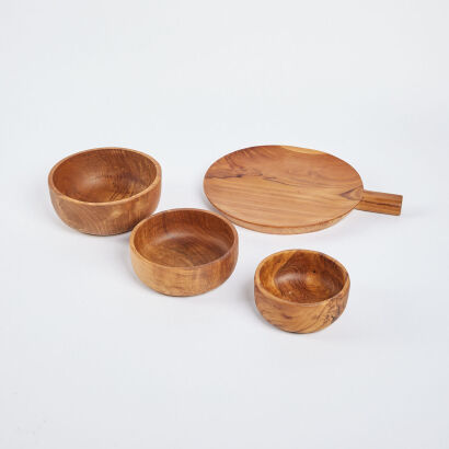 A Set Of Four Teak Dishes