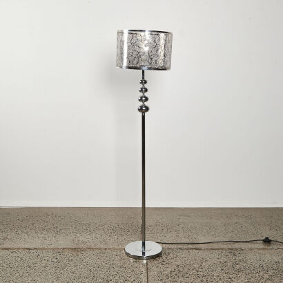 A Contemporary Silver Metal Lamp With Decorative Shade With Edison Bulb