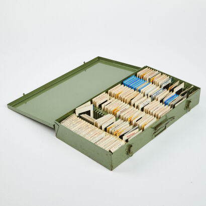 A Large Collection Of Slides In A Hanimex Box