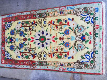 A Persian Hand-Knotted Wool Rug