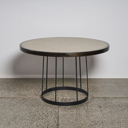 A Circular Pedestal Table With Textured Resin Top & Solid Iron Base