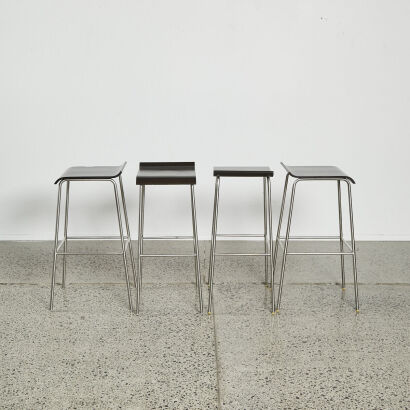 A Suite Of Four Minimal Barstools In Stainless Base And Moulded Ply Seat