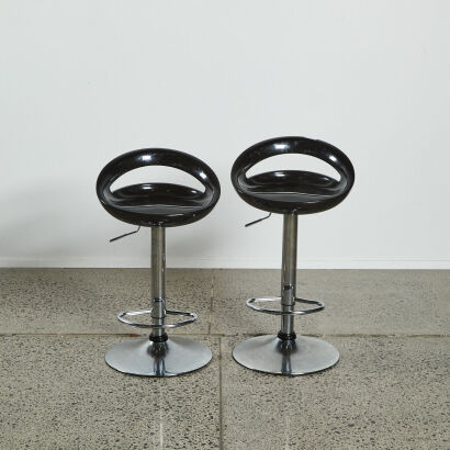 A Pair of Black And Chrome Bar Stools