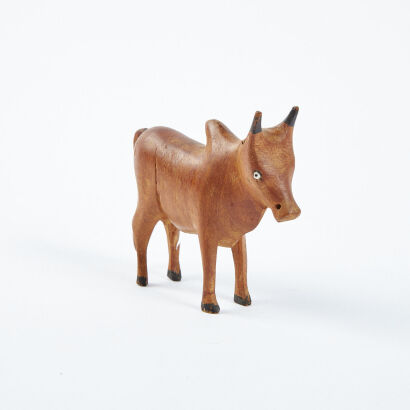 A Small Hand Carved Brahman Cow