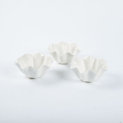 A Trio Of White Wavy Porcelain Bowls