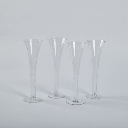 A Set Of Four Etched Hollow Steamed Champagne Glasses