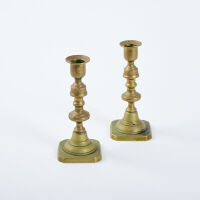 A Pair Of Brass Candle Sticks