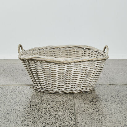 A Large Vintage Cane Laundry Basket