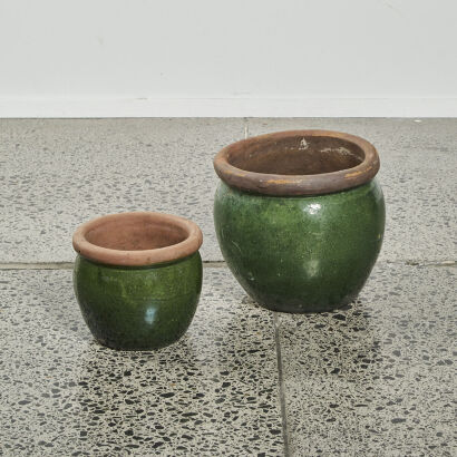 A Pair Of Green Glazed Pots