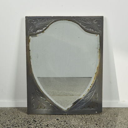 A Vintage Bevelled Shield Mirror In Carved Frame