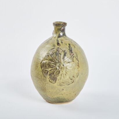 A Large Neil Grant Wine Vessel With Carved Floral Front