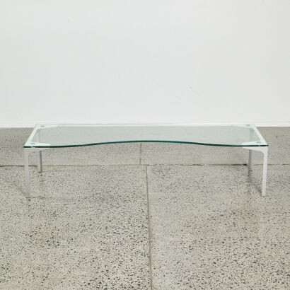 A Contemporary Curved Front Glass Coffee Table With Cast Aluminium Legs