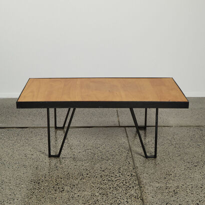 An Industrial Coffee Table with Solid Wood Top and Black Metal Frame