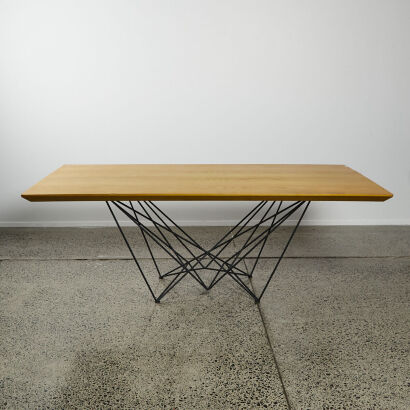 A Wooden Dining Table with Geometric Metal Base