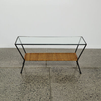 A 1950s Glass Top Coffee Table With A Cane Magazine Shelf