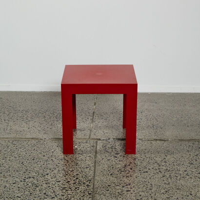 A Red Side Table By Kartell