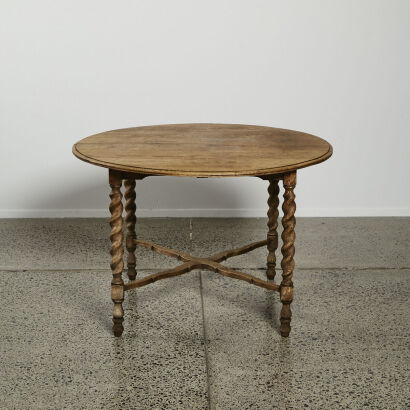 An Antique Oak Swedish Rustic Round Dining Table