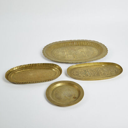 A Collection Of Four Hand Debossed Brass Platters