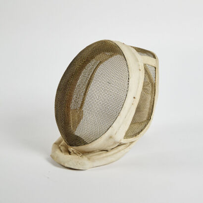 An Antique Cream Fencing Mask