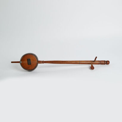 A Handmade Two String Instrument Made From A Coconut