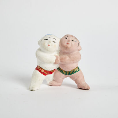 A Ceramic Figure Depicting Two Wrestlers