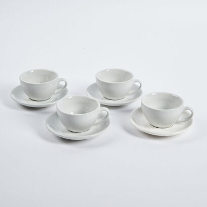 A Set Of Four Acme Cups And Saucers