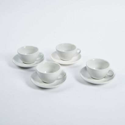 A Set Of Four Acme Cups And Saucers