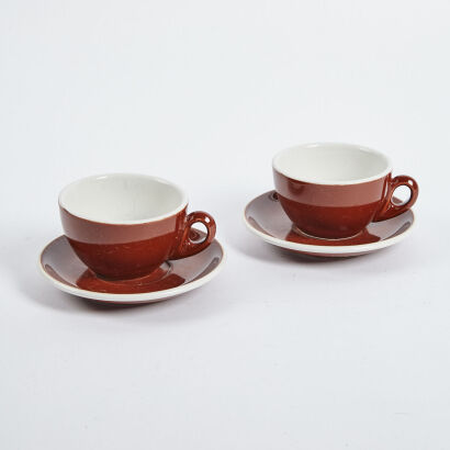 A Pair Of Coffee Cups And Saucers Made In Italy