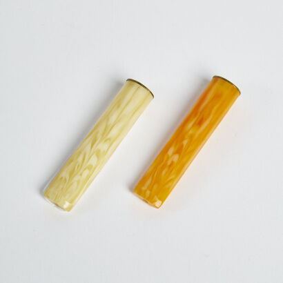 A Pair Of Art Deco Period Bakelite Cigarette Holders With Brass Ends