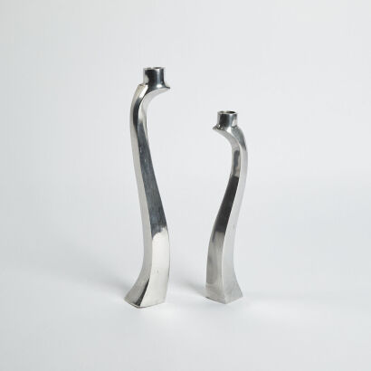 A Pair Of Biomorphic Aluminium Candle Holders