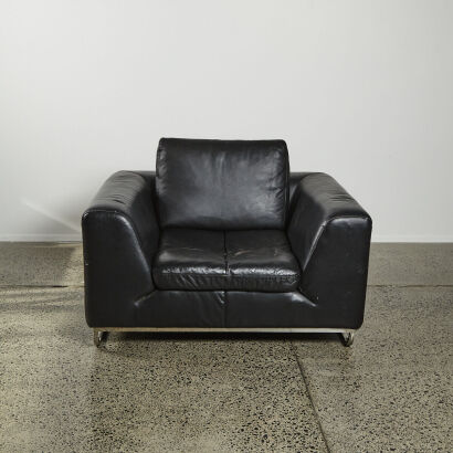 A Black Contemporary Lounge Chair With Metal Base