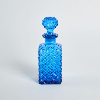 A Blue Resin Decanter With Stopper