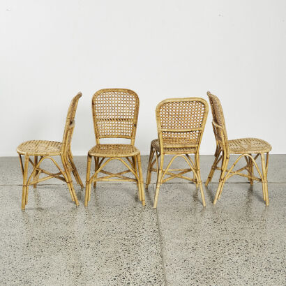 A Set Of Four Cane Dining Chairs