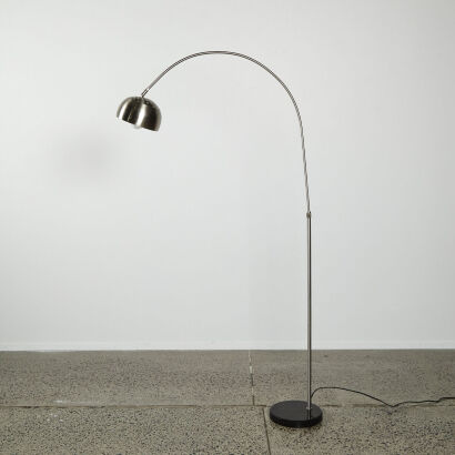 An Arched Floor Lamp With Black Marble Base