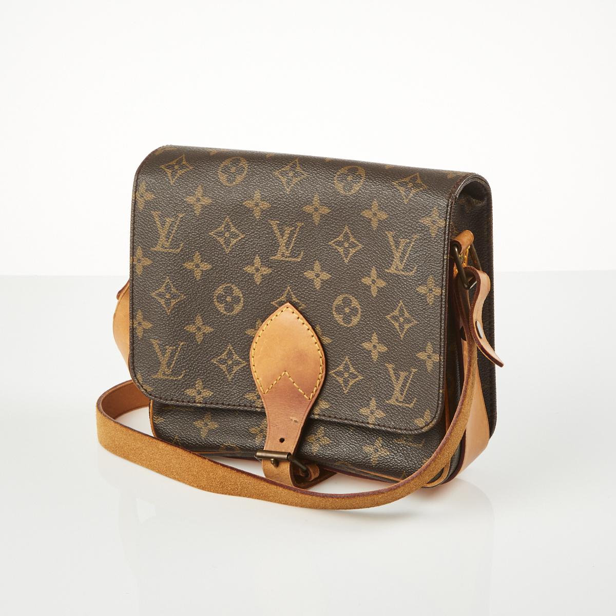 At Auction: A Louis Vuitton Monogram Cartouchiere Crossbody Bag.
