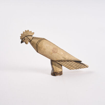 A Handmade Wooden Carving Of A Bird