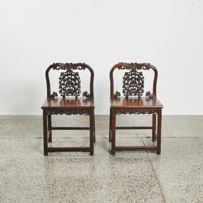 A pair of Chinese rosewood carved chairs